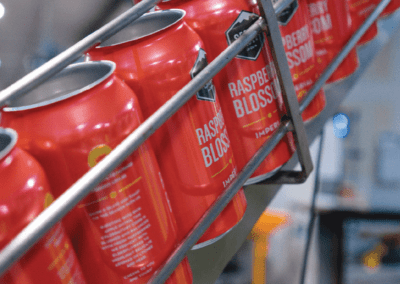 Raspberry cans on canning line