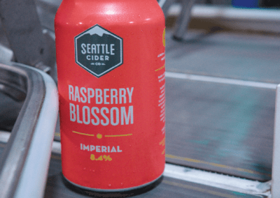 Can of raspberry on the canning line